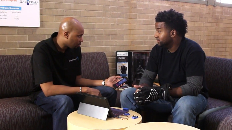 Tarik showing BearTek app to co-worker