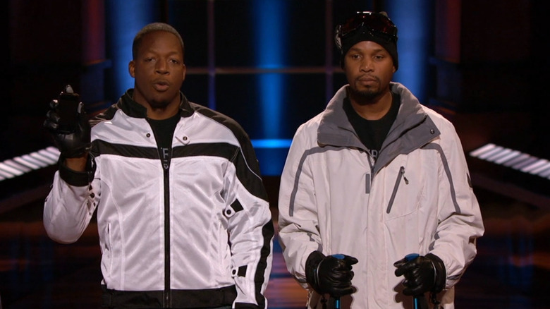 Willie and Tarik in sled gear presenting on Shark Tank