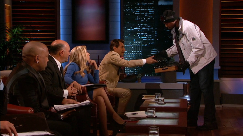 Tarik handing out glove samples to the sharks