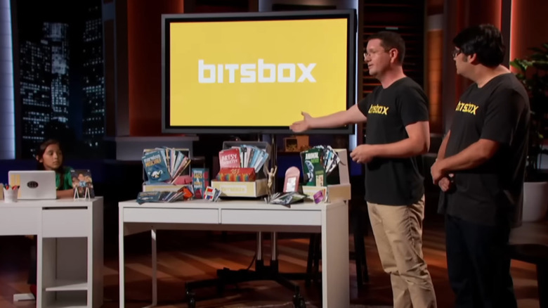 Scott gesturing towards Bitsbox display on Shark Tank