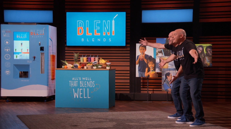 Stuart and Peter standing next to Bleni Blends on Shark Tank with excited gestures
