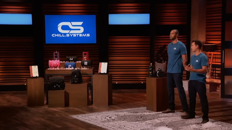 Brian and Chase talking next to Chill Systems display