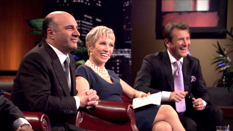 Panelists listening to Games2U Shark Tank Pitch