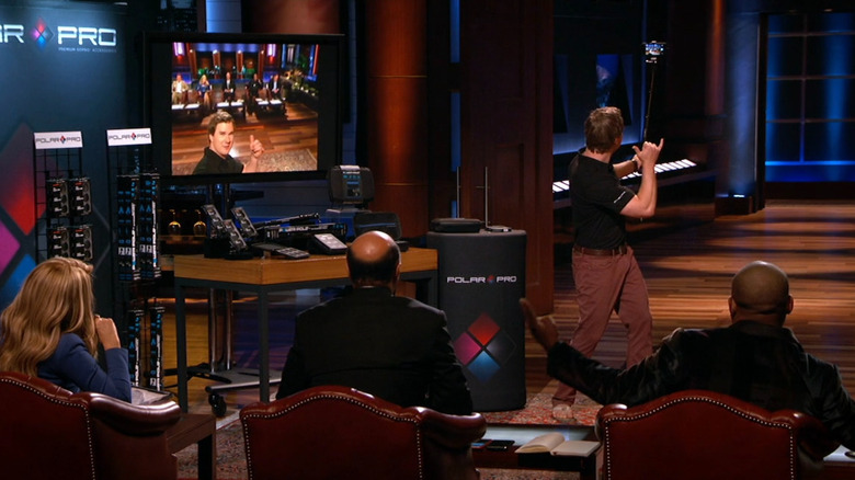 Jeff taking a selfie with sharks on Shark Tank
