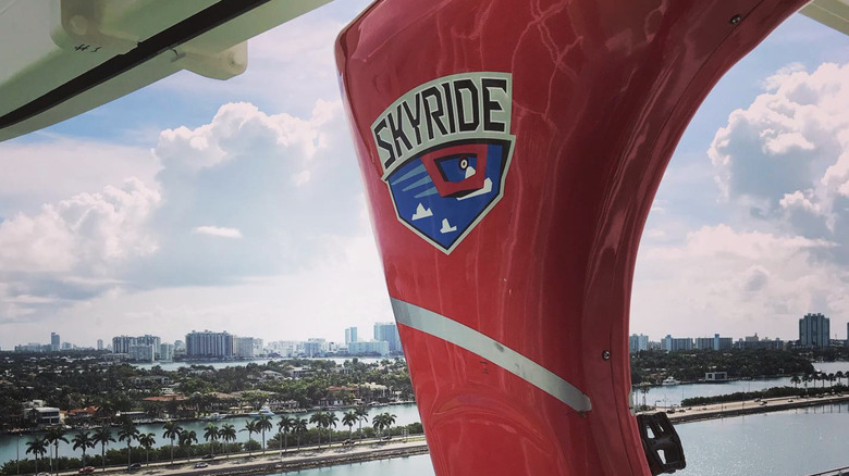 The SkyRide logo as seen on a red monorail.