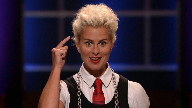 Lori speaking with an excited expression while on Shark Tank