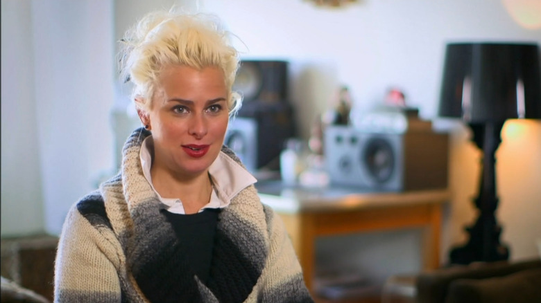 Cheek being interviewd in living room on Shark Tank