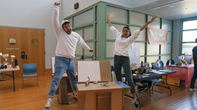 ChompShomp co-founders Max Liechty and Kausi Raman jumping for joy in classsroom