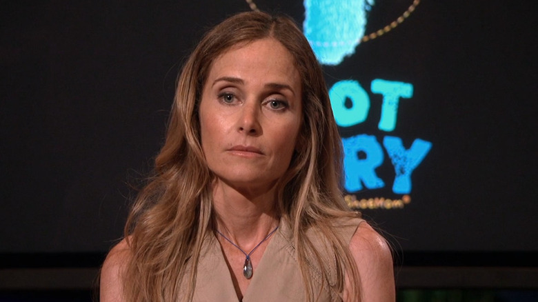 One of the Foot Fairy founders standing in front of the investors on Shark Tank