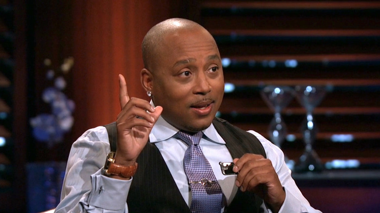 Daymond John listening to pitch about SoundBender on Shark Tank