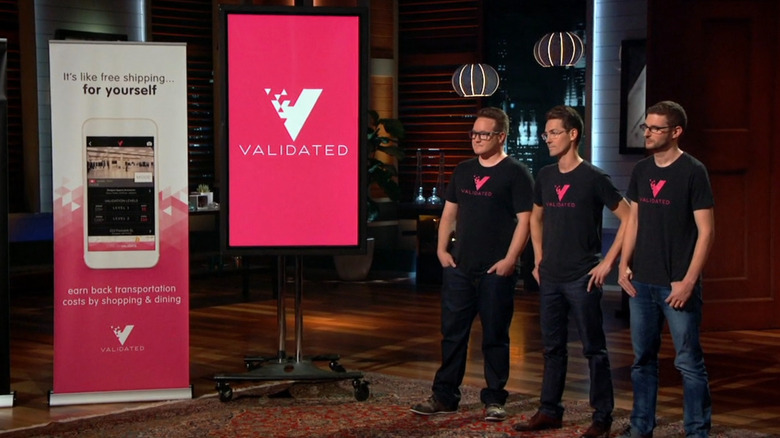 Ian, Tov, and Alex standing next to Validated display