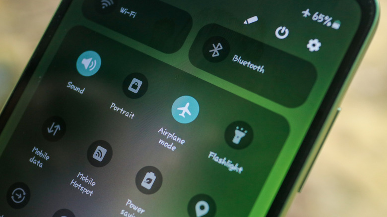 Close up of smartphone screen with airplane mode enabled.