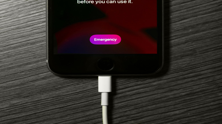 iPhone on table showing temperature warning screen