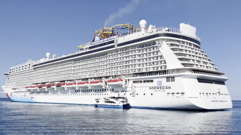 Breakaway cruise ship at sea viewed from a distance