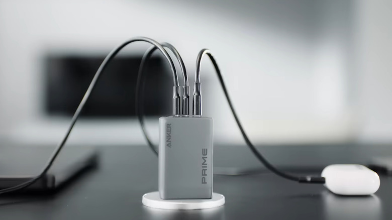 Anker GaN charger connected to AirPods laptop and phone