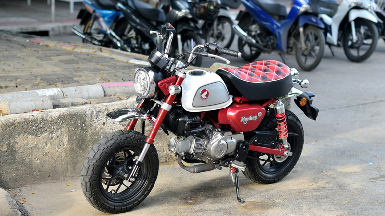 A Honda Monkey 125cc bike parked on a street in Bangkok, Thailand.