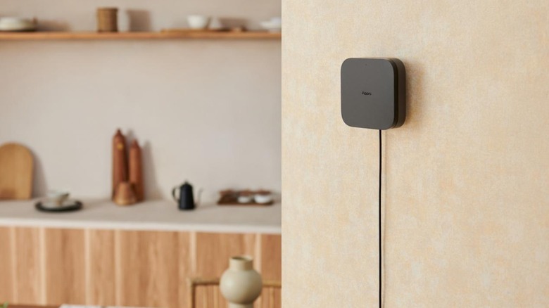 A smart home hub mounted on a wall