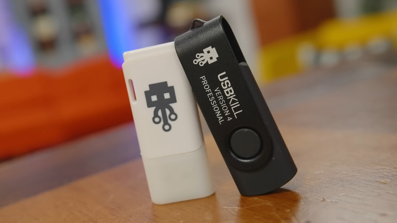 Black and white USB Kill sticks on a table