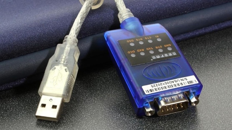 USB to serial adapter on blue and gray surface.jpg
