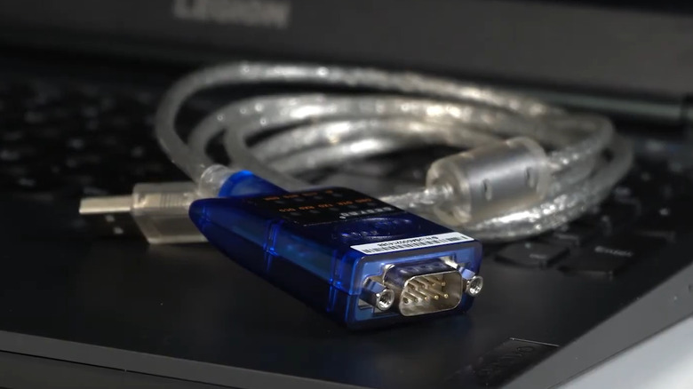 USB to serial adapter on a laptop keyboard