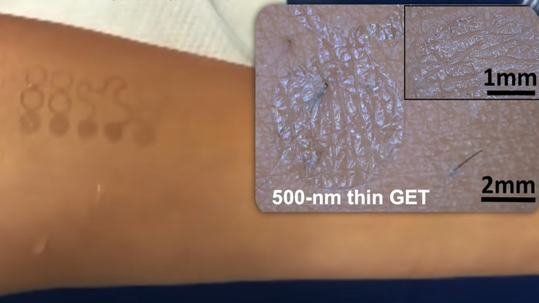 An uplcose look at an adhesive e-tattoo is shown during Dr. Nanshu Lu's TEDxTalk presentation.