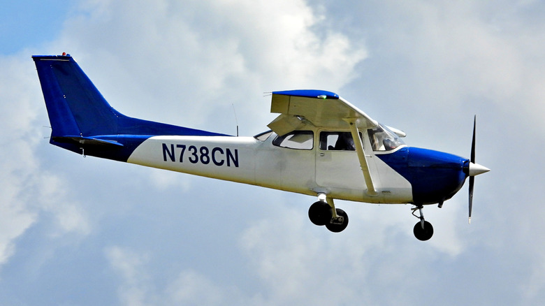 Side view of a small aircraft in flight.