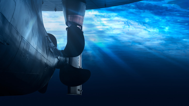 propeller and rudder of a massive ship underwater
