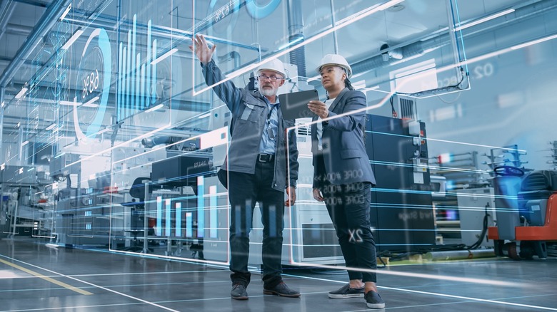 illustration of workers with hard hats checking analytics