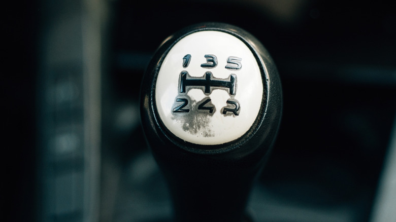 5-speed manual shift knob showing visible signs of wear