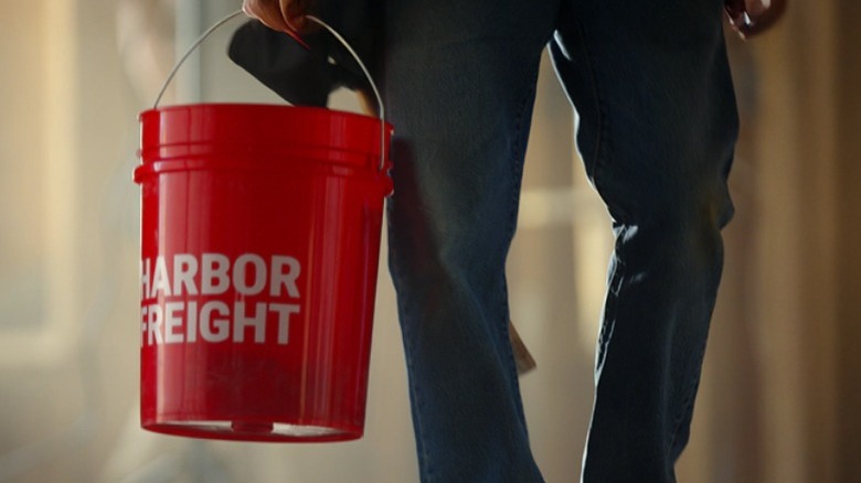 Customer holding Harbor Freight bucket