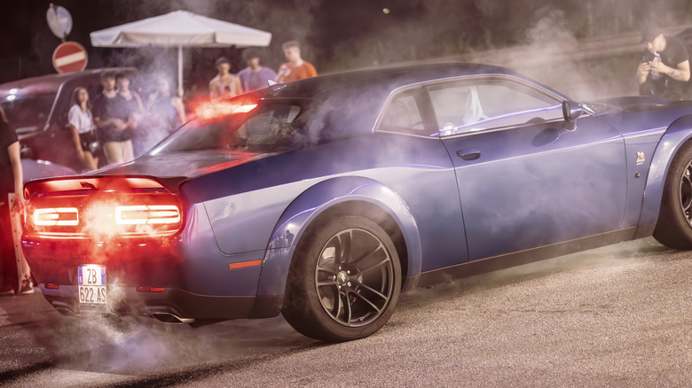 Dodge Challenger with smoking tires after doing burnout