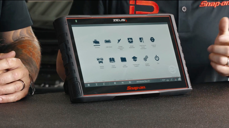 Snap-On employees demonstrating the ZEUS+ diagnostics tool