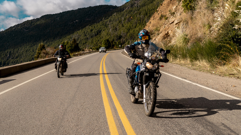 Motorcyclists riding motorcycles in Patagonia, Argentina