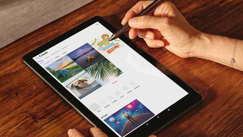 A user's hand holding a stylus pen while making sorting images using the Amazon Fire HD 10 tablet