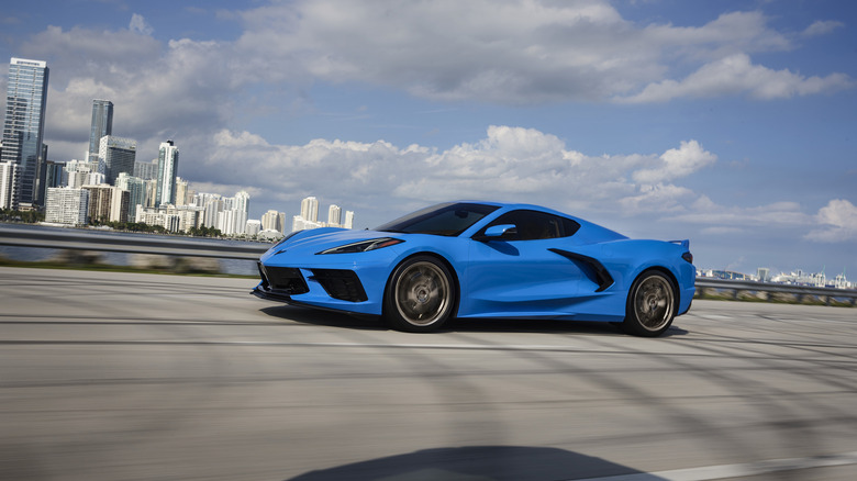 Front 3/4 view of a C8 Chevrolet Corvette in blue on the move