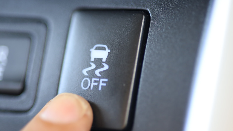 Driver pressing the ESC OFF button