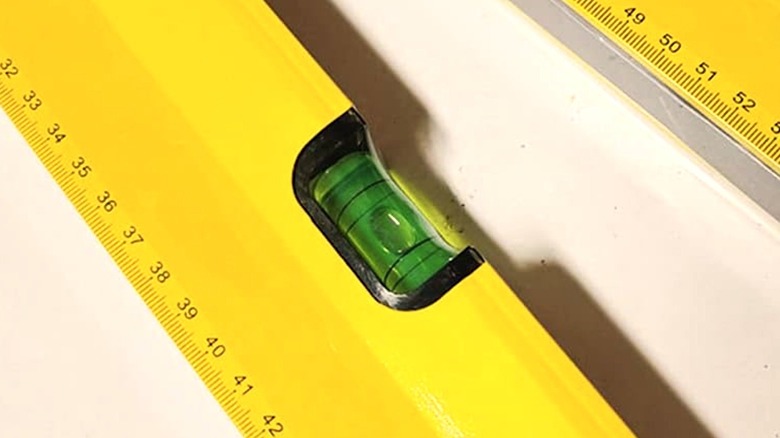 Closeup shot of the green fluid in a spirit level