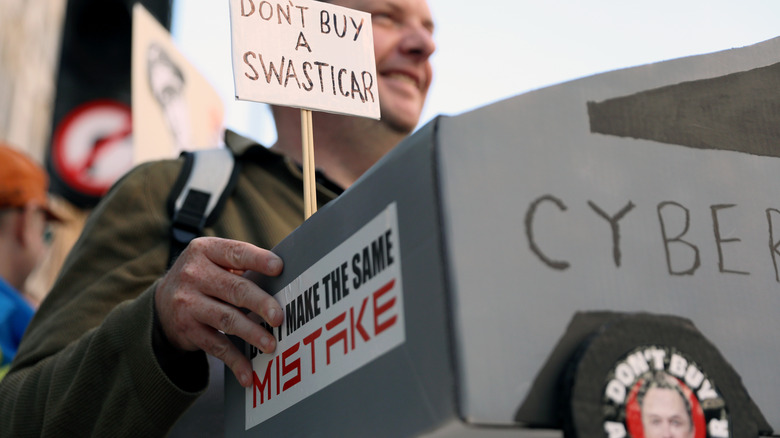 man protesting cybertrucks
