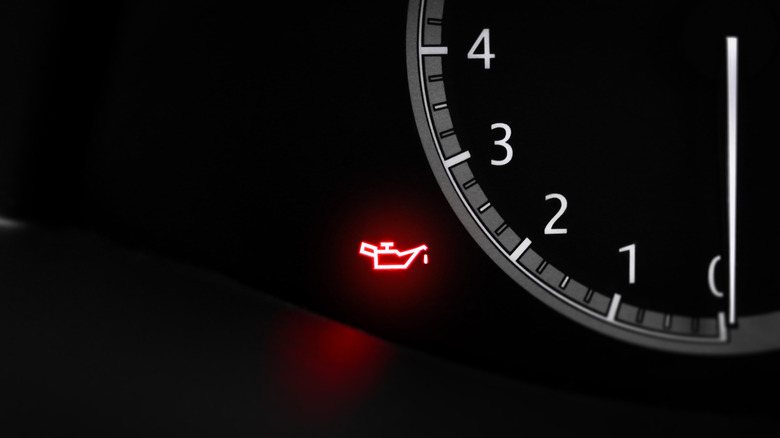 A red oil pressure light on an instrument cluster
