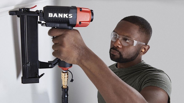Man using Banks air staple gun