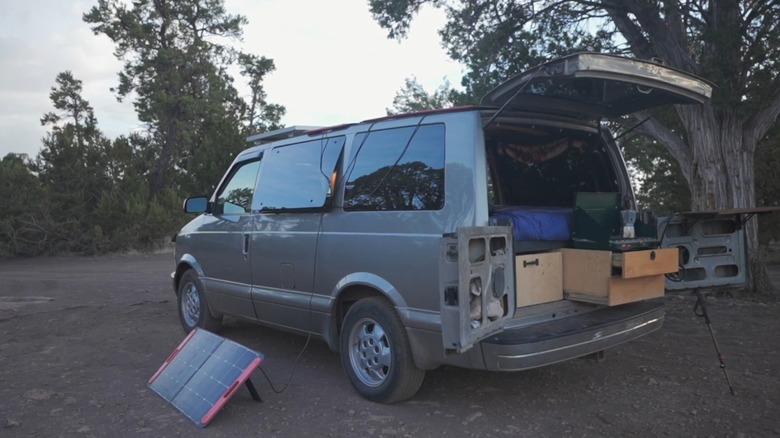 An Astro van converted into living quarters for overlanding