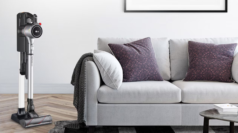 LG CordZero vacuum placed next to a sofa