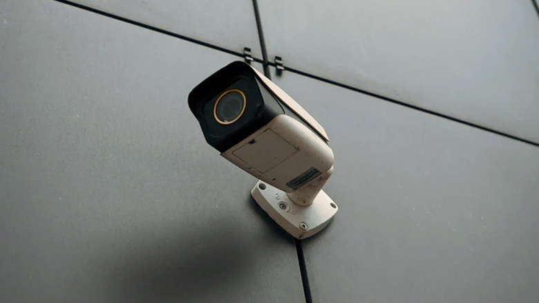 Security camera on the wall, CCTV on the buildings monitoring the street.