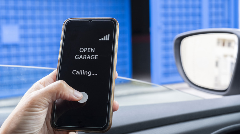 Person using phone to open garage