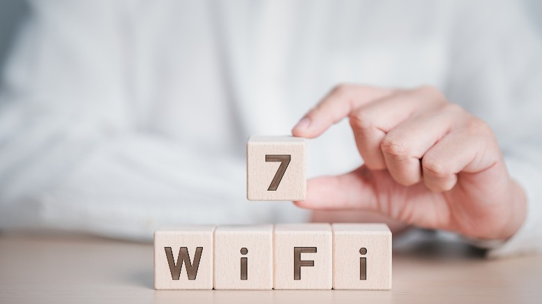 Blocks reading Wi-Fi with person holding the number 7
