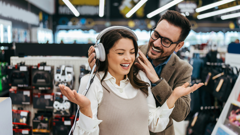 Couple shopping for headphones