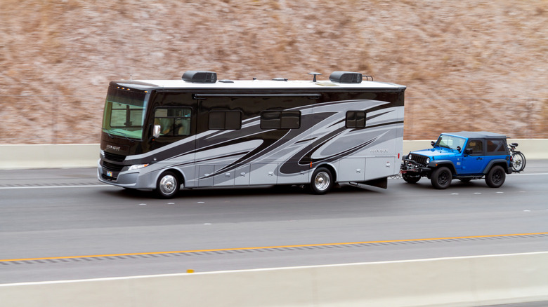 A Motorhome Flat Towing A Jeep Wrangler