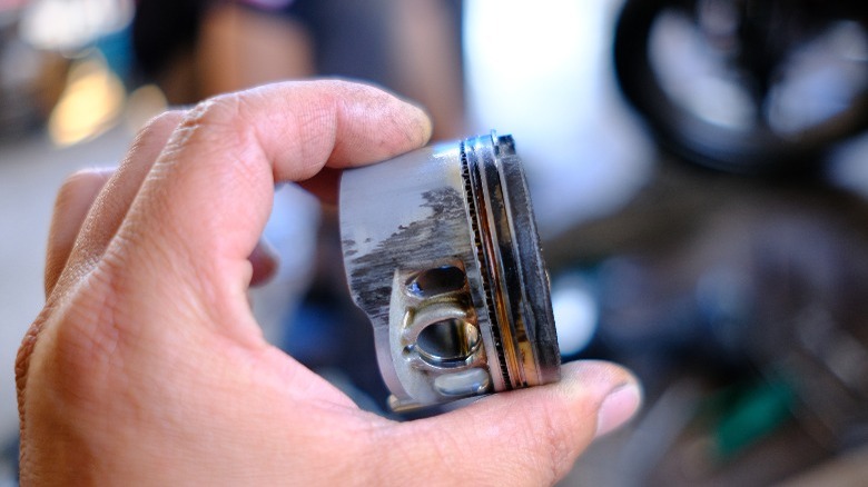 damaged motorcycle piston