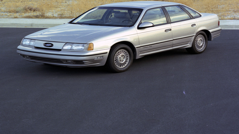 Front 3/4 static shot of a 1989 Ford Taurus SHO on a paved surface
