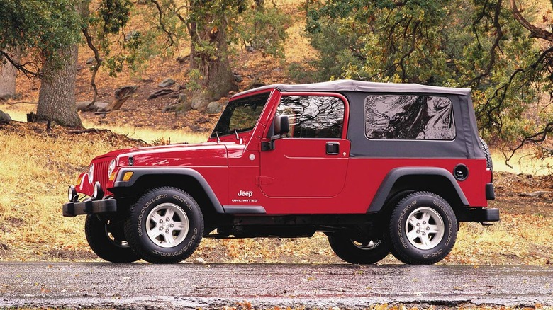 2004-2006 Jeep Wrangler Unlimited, red, left-side view, parked on roadside